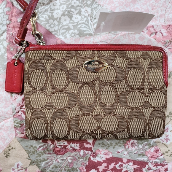 Coach Handbags - Coach wristlet good/used condition Classic C pattern